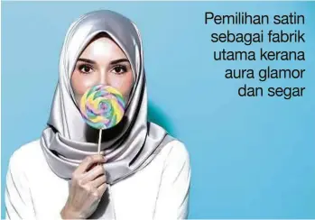  ??  ?? MANIS dipandang
dengan koleksi tudung bawal satin.