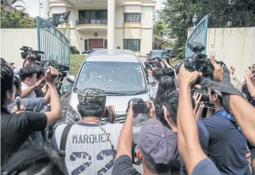  ?? EPA ?? Members of the media surround a North Korean official’s car at the North Korean embassy in Kuala Lumpur, Malaysia, yesterday.