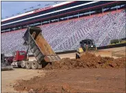  ?? DAVID CRIGGER — THE ASSOCIATED PRESS ?? Workers turn Bristol Motor Speedway into a dirt track earlier this year.