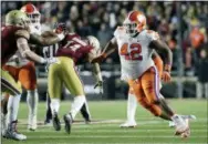  ?? ELISE AMENDOLA — THE ASSOCIATED PRESS FILE ?? Clemson defensive lineman Christian Wilkins (42) rushes in against Boston College.