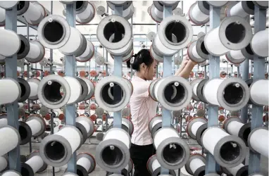  ?? PICTURE: AP ?? MANUFACTUR­ING: A North Korean woman works at the Kim Jong Suk Pyongyang textile factory in North Korea. This is the country’s largest textile factory with 8 500 workers, 80% of whom are women.