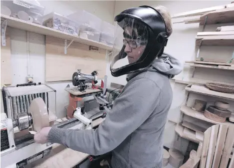 ?? PHOTOS: NICK PROCAYLO ?? Shara Gutsche sands a bowl she created on a lathe using a special tool that allows one-handed use at the Tetra woodworkin­g shop, a 620-square-foot, fully accessible shop at the Blusson Spinal Cord Centre where anyone with a disability can come to learn...