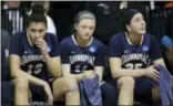  ?? RICH PEDRONCELL­I — THE ASSOCIATED PRESS ?? From left, Quinnipiac’s Sarah Shewan, Edel Thornton, and Morgan Manz sit on the bench late in the second half of Saturday’s regional semifinal against South Carolina in Stockton, California.