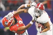  ?? John Bazemore / Associated Press ?? Alabama tight end Irv Smith Jr. stiff arms Georgia defensive back Tyson Campbell in the SEC championsh­ip.