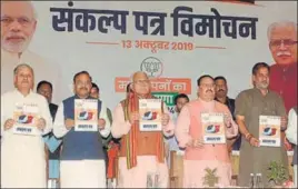  ?? ANIL DAYAL/HT ?? Haryana chief Manohar Lal Khattar with BJP’S working national president JP Nadda and other leaders releasing the party’s manifesto in Chandigarh on Sunday.