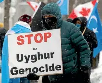  ?? AP ?? Canada’s parliament has followed the United States in declaring that China is committing genocide against its Uyghur minority, and says Beijing should be stripped of next year’s Winter Olympics.