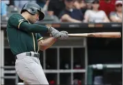  ?? KAMIL KRZACZYNSK­I — THE ASSOCIATED PRESS ?? The Athletics’ Matt Olson hits two-run home run off Chicago’s Lucas Giolito during the fourth inning Sunday.