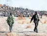  ?? ?? LEADERS of striking miners at a protest at the Lonmin mine. Of the 44 people who died in the series of tragic events of August 2012, up to 37 were killed by the police. | AP