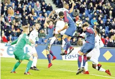  ??  ?? Paris Saint-Germain’s French midfielder Adrien Rabiot (R) heads the ball and scores a goal during the French Cup round of 16 football match between Paris Saint-Germain (PSG) and Guingamp (EAG) at the Parc des Princes stadium in Paris. - AFP photo