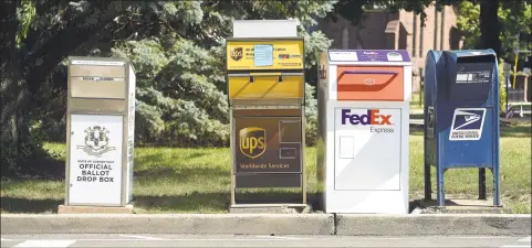  ?? Arnold Gold / Hearst Connecticu­t Media ?? A Connecticu­t Official Ballot Drop Box was installed across from Milford City Hall next to FedEx, UPS and U.S. Postal Service boxes