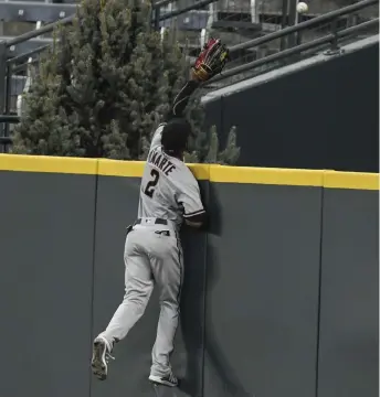  ?? AAron Ontiveroz, The Denver Post ?? Ketel Marte of the Arizona Diamondbac­ks cannot get to a home run by Colorado’s Nolan Arenado during the fourth inning at Coors Field on Tuesday night.