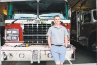  ?? Grace Duffield / Hearst Connecticu­t Media ?? New Canaan volunteer firefighte­r Richard William Garbus stands in front of a fire truck at the New Canaan Fire Department on Aug. 7. Garbus is becoming a profession­al firefighte­r for the town.