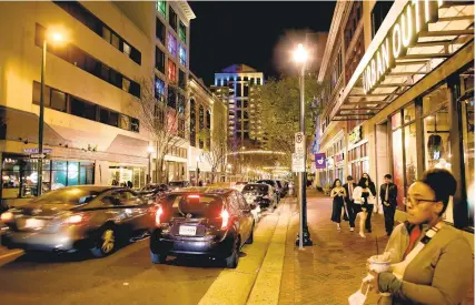  ?? STEPHEN M. KATZ/STAFF ?? A look down Granby Street in Norfolk on Friday night, a week after five people were shot and two killed — including Virginian-Pilot and Daily Press reporter Sierra Jenksins — outside a restaurant and bar.