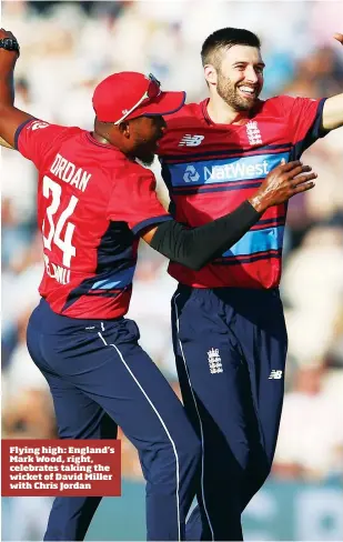  ??  ?? Flying high: England’s Mark Wood, right, celebrates taking the wicket of David Miller with Chris Jordan