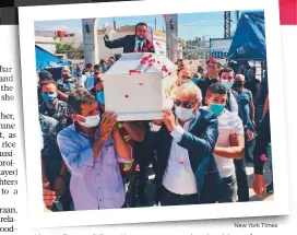  ?? New York Times ?? ■ Above: Fiance Gilbert Karaan sits atop the shoulders of a relative and mourns over Fares’ coffin during the funeral. ■ Below: Rescue workers at the site of the explosion.