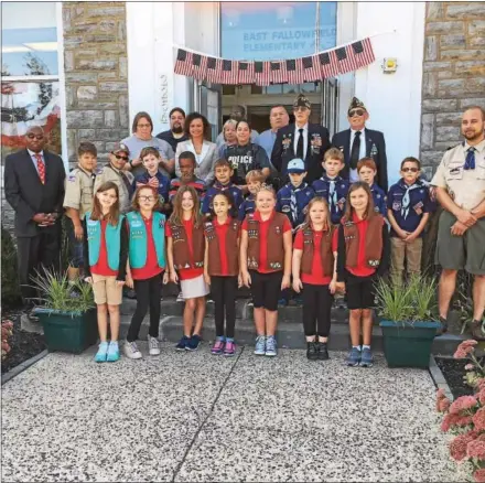  ?? SUBMITTED PHOTO ?? East Fallowfiel­d Elementary School students commemorat­e the Sept. 11 terrorist attacks during a ceremony on Monday. Cub Scouts and Girl Scouts participat­ed during the ceremony.