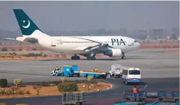  ?? Reuters ?? A Pakistan Internatio­nal Airlines plane prepares to take off at Allama Iqbal Internatio­nal Airport in Lahore.