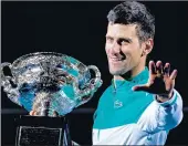  ?? MACKENZIE SWEETNAM/TNS ?? Novak Djokovic celebrates after his victory in the Australian Open men's final. It is his 9th Austrailia­n Open title and 18th Grand Slam title overall.