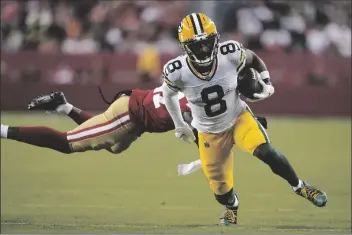  ?? GODOFREDO A. VÁSQUEZ/AP ?? GREEN BAY PACKERS WIDE RECEIVER AMARI RODGERS (8) runs past San Francisco 49ers cornerback Dontae Johnson to score during the second half of a preseason game in Santa Clara, Calif., on Aug. 12.