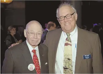  ?? PHoToS By AlEx SHuRE ?? DOGS’ BEST FRIENDS: Robert Beal, left, is congratula­ted for receiving the Noble Award by MSPCA President Carter Luke, right.