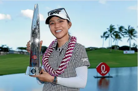  ?? CREDIT: CHRISTIAN PETERSEN/GETTY IMAGES. ?? Lydia Ko poses with the trophy after winning the LPGA LOTTE Championsh­ip at Kapolei Golf Club in Hawaii.