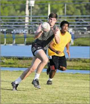 ?? The Sentinel-Record/Mara Kuhn ?? JUNIOR STORMERS: Jessievill­e High School senior Steven Benson, left, and Hot Springs World Class High School junior Logan Grant practice Wednesday at Jessievill­e for the Little Rock Junior Stormers rugby club. Benson is one of two All-Americans on the...