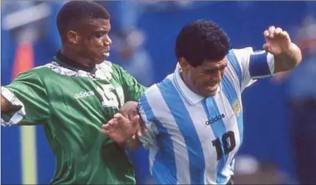  ??  ?? Diego Amando Maradona held his ground against Sunday Oliseh’s shove at the 1994 World Cup in the US