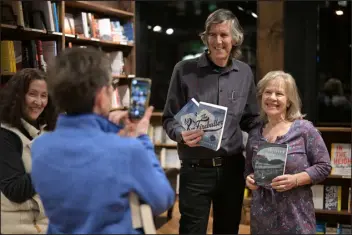  ?? PHOTOS BY HYOUNG CHANG — THE DENVER POST ?? Colorado author Mark Stevens, top, takes a picture with Cynthia Swanson, right, and readers at Tattered Cover in Denver on Feb. 2.