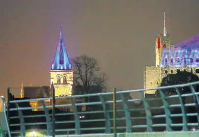  ??  ?? The NHS logo beamed onto the side of Rochester Castle as the Cathedral next door is lit up blue for the Clap for Carers to support NHS workers during coronaviru­s