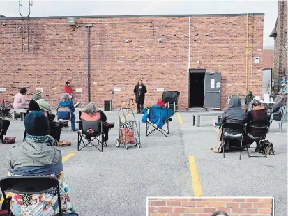  ?? ANDY CARROLL PHOTO ?? Spoken word artists and poets take part in an outdoor afternoon performanc­e outside the Theatre on King on Oct. 24.