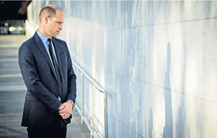  ??  ?? The Duke of Cambridge pauses after placing a wreath at the Oi Manawa Canterbury Earthquake Memorial in Christchur­ch. Left, Jacinda Ardern, the prime minister, waiting for the Duke’s arrival