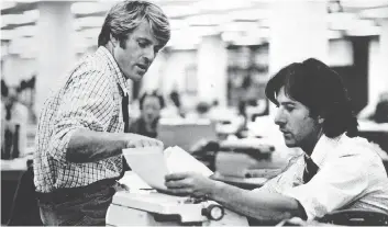  ??  ?? Robert Redford, left, and Dustin Hoffman are shown in a scene from All the President’s Men.