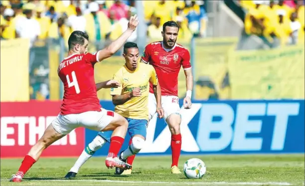  ?? AFP ?? Mamelodi Sundowns’ forward Sirino Rodrigues (centre) vies for the ball with Al-Ahly’s Mahmoud Mansour (left) and midfielder Ali Maaloul during the Quarter-final second leg.