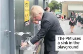  ??  ?? The PM uses a sink in the playground