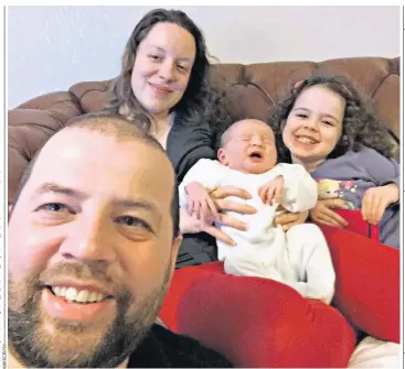  ??  ?? Newborn baby Pippa Griffiths with her mother Kayleigh, sister Brooke and dad Colin. She died from an infection contracted at birth