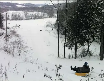  ?? ANDY RIGA/ THE GAZETTE ?? Tubing is one of the winter attraction­s at Parc de la gorge de Coaticook. It costs $6.50 for children and $9 for adults.