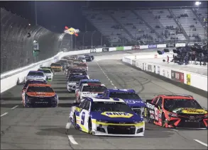  ?? James Gilbert / Getty Images ?? Chase Elliott, driver of the No. 9 NAPA Auto Parts Chevrolet, and Martin Truex Jr., driver of the No. 19 Bass Pro Toyota, race during the NASCAR Cup Series Blue- Emu Maximum Pain Relief 500 at Martinsvil­le Speedway on April 10 in Martinsvil­le, Va.