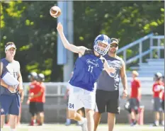  ?? Gregory Vasil / For Hearst Connecticu­t Media ?? Darien quarterbac­k Peter Graham passes during the 11th Annual Grip It and Rip It competitio­n on Saturday.