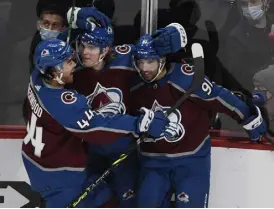  ?? Andy Cross, The Denver Post ?? Avalanche defenseman Bowen Byram, center, celebrates a goal against Columbus with teammates Kiefer Sherwood, left, and Nazem Kadri on Wednesday night.