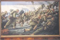  ??  ?? The painting titled ‘4th Marine Division Landing on Iwo Jima’, right, shows a major 1945 battle in which US marines seized the island of Iwo Jima from the Japanese army.