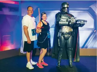  ??  ?? Megan and her father share a moment with Captain Plasma of the First Order