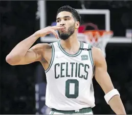  ?? John Minchillo Associated Press ?? JAYSON TATUM blows a kiss to the Brooklyn crowd as the Celtics completed a sweep of what many thought could be a tough first-round series against the Nets.