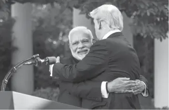  ?? Jabin Botsford ?? President Donald Trump and Indian Prime Minister Narendra Modi’s Rose Garden hug amid surprised onlookers.