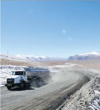  ?? FILES VYACHESLAV OSELEDKO/AFP/GETTYIMAGE­S ?? A truck moves along a road near Centerra’s Kumtor gold mine, which was the target of London-listed Chaarat’s takeover bid that Centerra had rejected in April. The Toronto-based gold company is also stuck in conflicts with Kyrgyz authoritie­s related to...