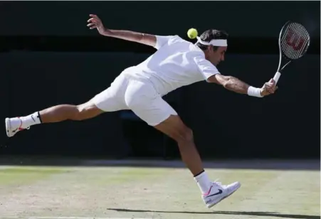  ?? KIRSTY WIGGLESWOR­TH/THE ASSOCIATED PRESS ?? Roger Federer reached his 11th Wimbledon final by beating Tomas Berdych in straight sets on Friday. Federer has not dropped a set in the fortnight.