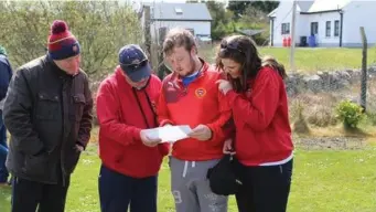  ??  ?? Monivea coaches Alan Ward, Delcan Cunny, Damien Costello and Ellish Murray discuss tactics before an U-12 blitz