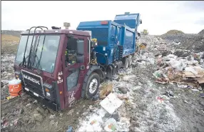  ?? (NWA Democrat-Gazette/Hank Layton) ?? A garbage truck driven by Gustavo Garcia unloads waste Friday at the Fort Smith landfill. Go to nwaonline.com/211031Dail­y/ to see more photos.