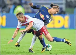  ?? AFP ?? Both sides staged an evenly balanced first half with opportunit­ies at both ends of the pitch before Leipzig turned up the heat after half time to smoothen the way for the win.