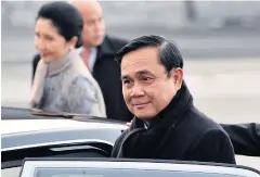  ?? AFP PHOTO / YOSHIKAZU TSUNO ?? Prime Minister Prayut Chan-o-cha and his wife Naraporn at Tokyo Internatio­nal Airport yesterday. Gen Prayut is on a three-day visit to Japan.