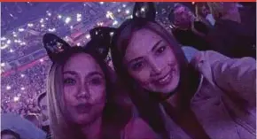  ??  ?? Wan Amalia Wan Jazmi (right) and her friend, Iffa Syazwanie, at the Ariana Grande concert at Manchester Arena before the explosion.